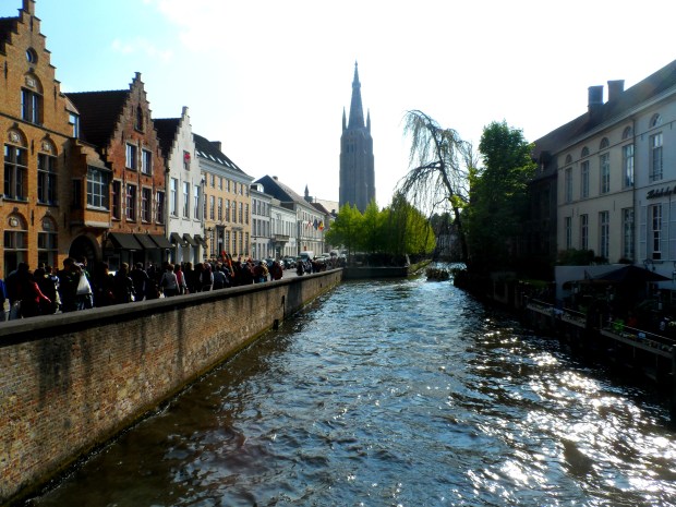 The Church of Our Lady standing tall over Bruges's canals