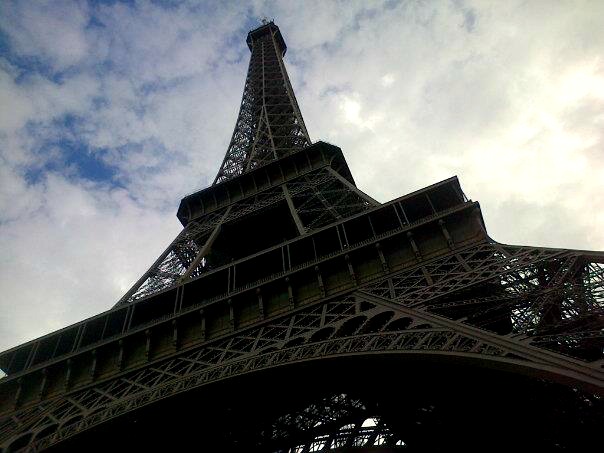 Standing under the Eiffel Tower